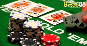 poker chips and playing cards on top of a poker table